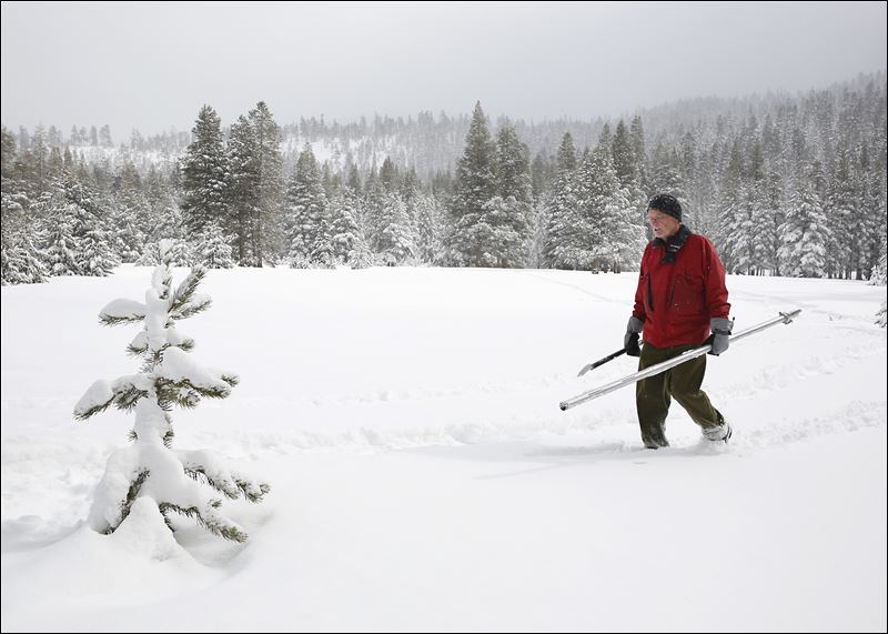 Frank Gehrke chief of the California Cooperative Snow Surveys Program for the Department of Water Resources crosses a snow covered meadow after conducting the second manual snow survey of the season at Phillips Station near Echo Summit Calif. Tuesday