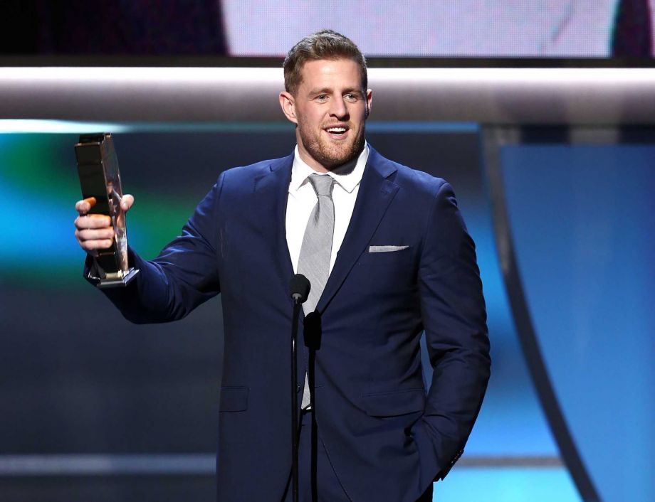 The Texans J.J. Watt accepts the NFL Defensive Player of the Year trophy Saturday in San Francisco