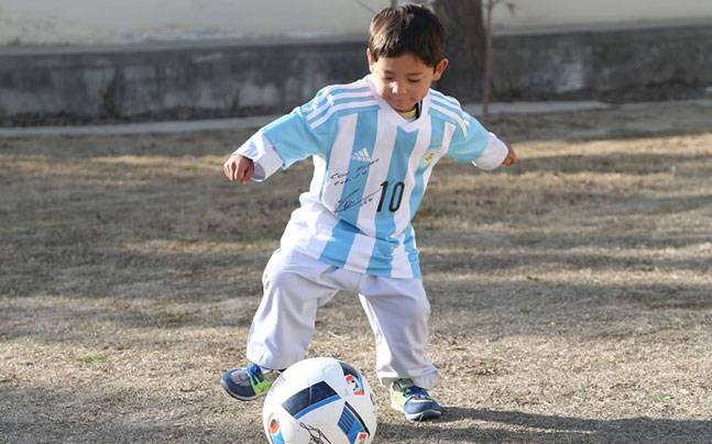 Boy In The Bag: Lionel Messi Personally Sends Signed Shirt To Little Aghan Fan Murtaza (Photo)