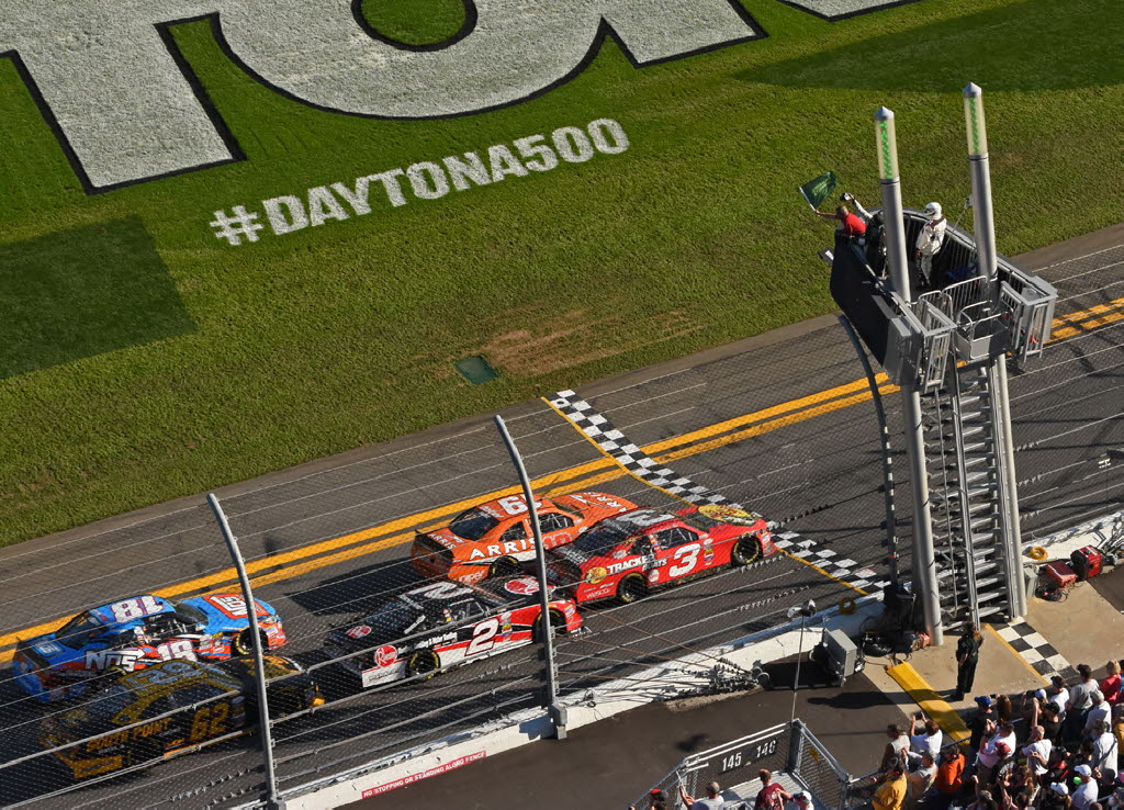 Ty Dillon and Daniel Suarez take the green flag to start the race