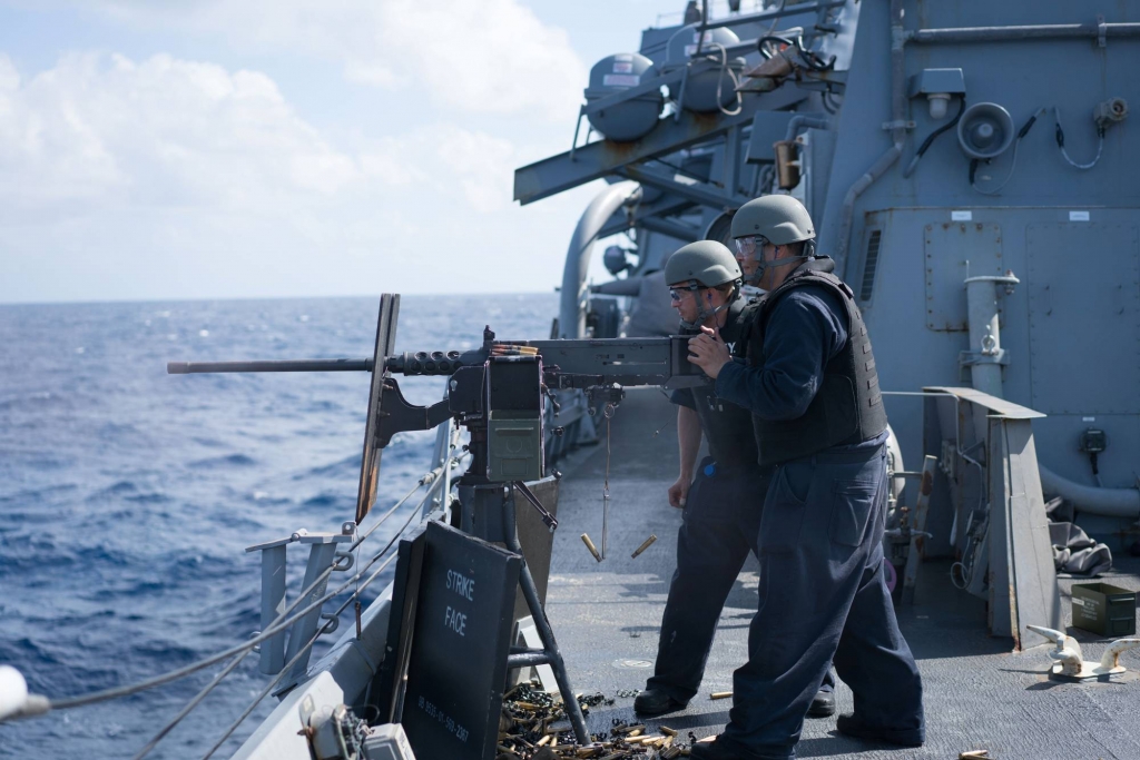 File Sailors aboard Arleigh Burke-class guided-missile destroyer USS Curtis Wilbur fire a M2HB.50-caliber machine gun during a gunnery exercise in the South China Sea. Curtis Wilbur is on patrol in the 7th Fleet area of responsibility in support