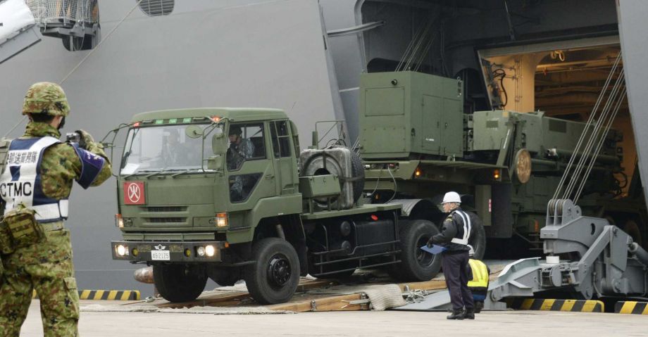 A vehicle carrying a PAC-3 missile interceptor arrives at a port on Ishigaki Island Okinawa prefecture southwestern Japan Saturday Feb. 6 2016. North Korea has moved up the window of its planned long-range rocket launch to Feb. 7-14 South Korea's Def