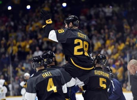 All-Star Game MVP John Scott was carried off the ice by other members of the victorious Pacific Division team