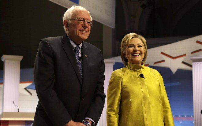 Democratic presidential candidates Sen. Bernie Sanders and Hillary Clinton take the stage before the PBS News Hour Democratic Debate at the University of Wisconsin Milwaukee Thursday