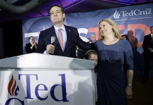 Republican presidential candidate Sen. Ted Cruz R-Texas arrives for a caucus night rally with his wife Heidi and daughter Caroline 7 Monday Feb. 1 2016 in Des Moines Iowa