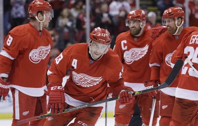 Detroit Red Wings center Pavel Datsyuk of Russia skates to the bench after celebrating with teammates during the second period of an NHL hockey game Sunday Feb. 14 2016 in Detroit. Datsyuk is the NHL's first star of the week after his five goals