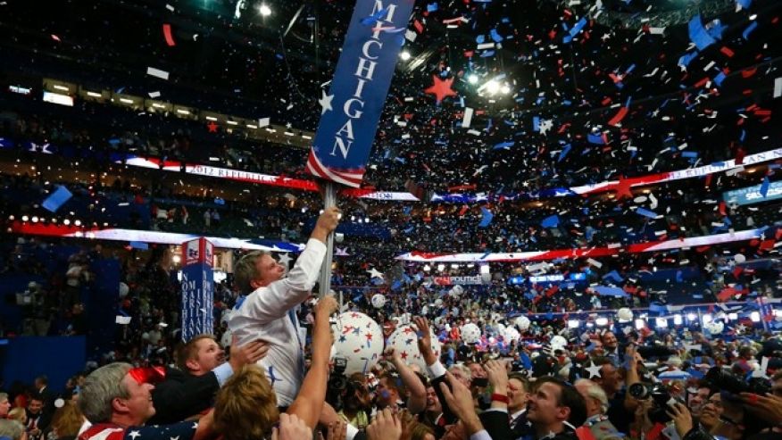 Michigan delegates celebrate after Mitt Romney accepts the nomination at the Republican National Convention in Tampa Florida