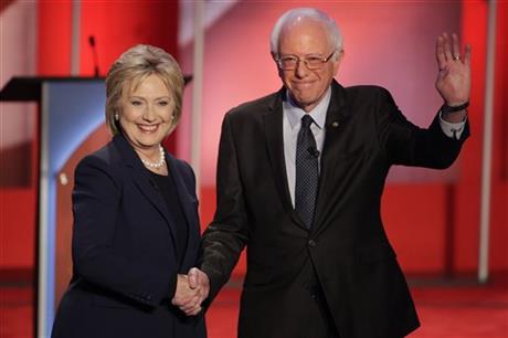 Democratic presidential candidate Hillary Clinton and Democratic presidential candidate Sen. Bernie Sanders I-Vt shakes hands as they greet the audience before the audience before a Democratic presidential primary debate hosted by MSNBC at the Univers