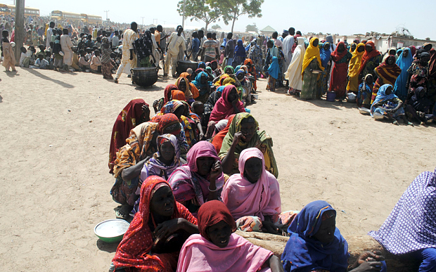 Displaced people queue for food at Dikwa camp where the attacks took place earlier this month