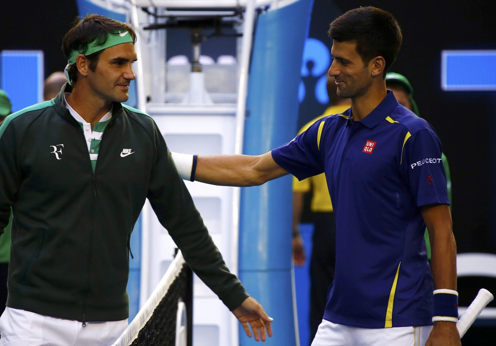 Switzerland's Roger Federer and Serbia's Novak Djokovic greet each other before their semi-final match at the Australian Open tennis tournament at Melbourne Park