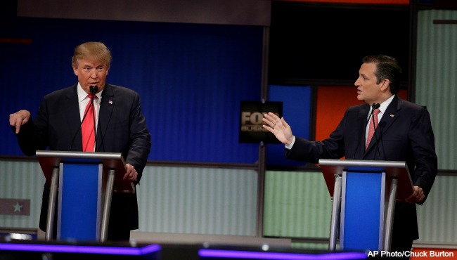 Republican presidential candidate businessman Donald Trump speaks as Republican presidential candidate Sen. Ted Cruz R-Texas looks on during the Fox Business Network Republican presidential debate at the North Charleston Coliseum Thursday Jan. 14 2