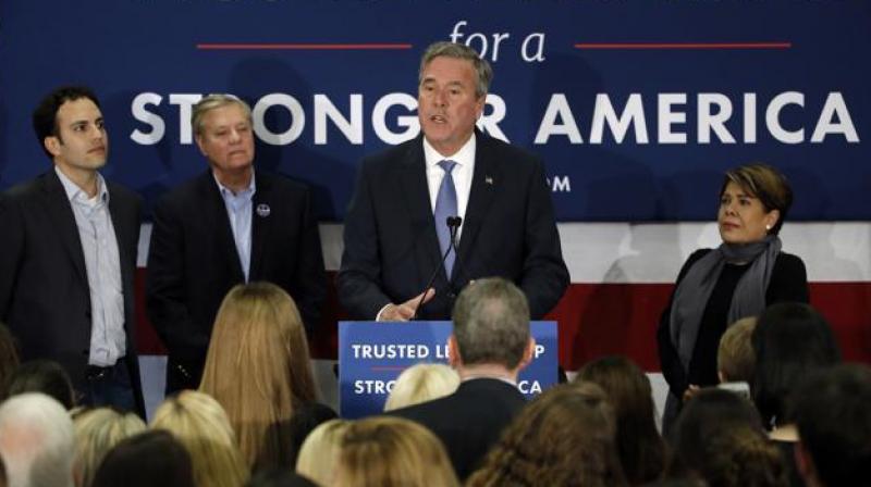 Former Florida governor Jeb Bush announcing his end in the Republican race for the White House in Columbia South Carolina on Saturday accompanied by with his wife Columba son Jeb Bush Jr., and senator Lindsey Graham