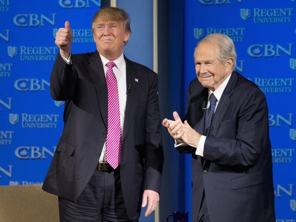 Republican presidential candidate Donald Trump accompanied by Rev. Pat Robertson gives a thumbs up to the crowd after speaking at Regent University in Virginia Beach Va. Wednesday Feb. 24 2016