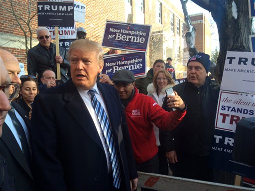 Donald Trumps greets voters at Webster Elementary School in Manchester N.H. Tuesday Feb. 9 2016