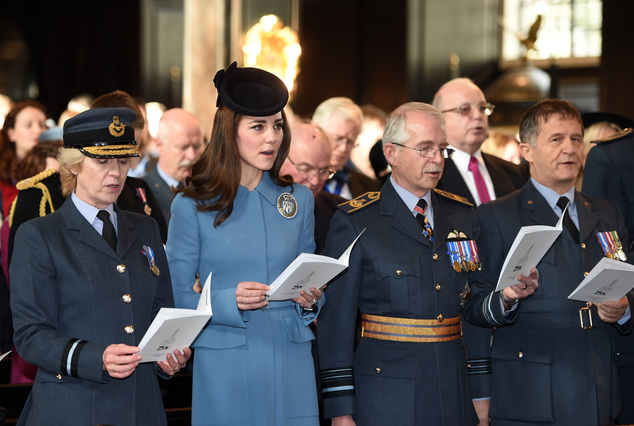 Britain's Kate the Duchess of Cambridge second left sings during a service at RAF church St Clement Danes to mark the 75th anniversary year of the RAF A