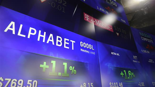 Electronic screens post the price of Alphabet stock on Monday at the Nasdaq Market Site in New York