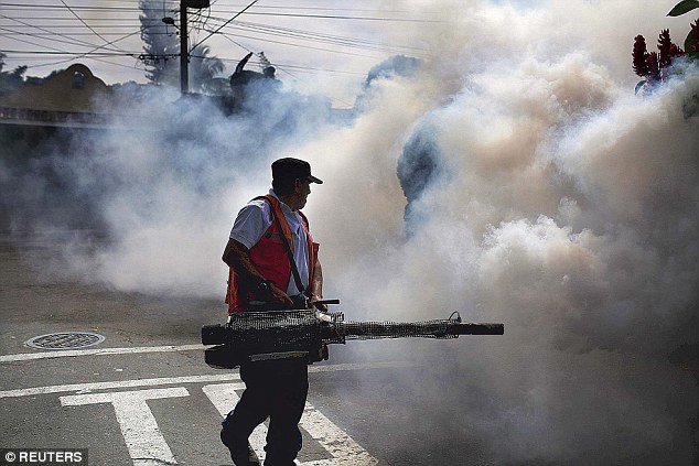 Emergency Workers in El Salvador fumigate as part of the preventive measures against the Zika virus