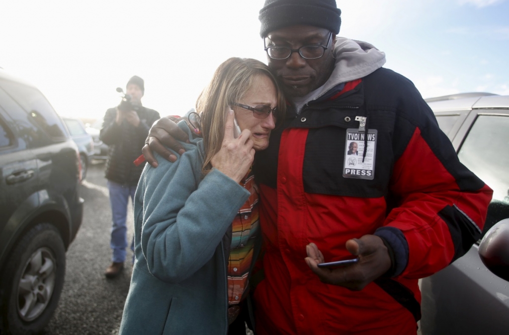 Barbara Berg an occupation sympathizer is comforted at a roadblock near the headquarters of the Malheur National Wildlife Refuge outside Burns Oregon