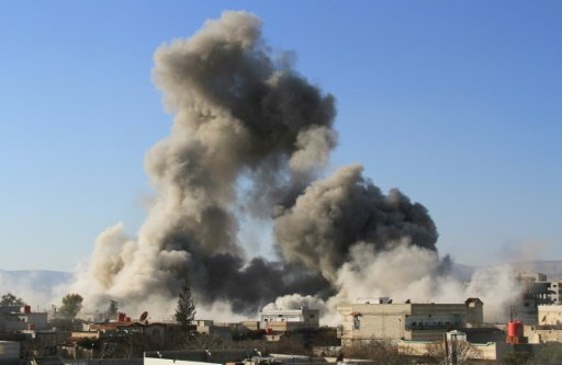 Fadi Dirani  AFP | Smoke ascends after a Syrian military helicopter allegedly drops a barrel bomb over Daraya