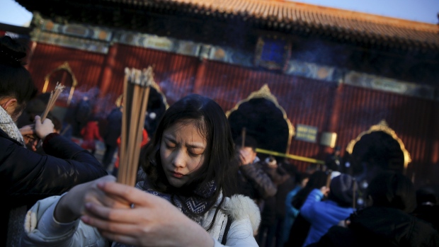 Thousands of people gathered to burn incense and pray for good fortune at Yonghegong Lama Temple in Beijing in observance of the first day of the Lunar New Year on Feb. 8 2016