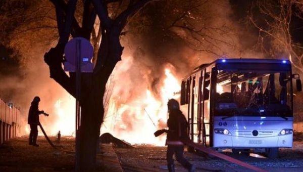 Firefighters prepare to extinguish fire after an explosion in Ankara Turkey Feb. 17 2016