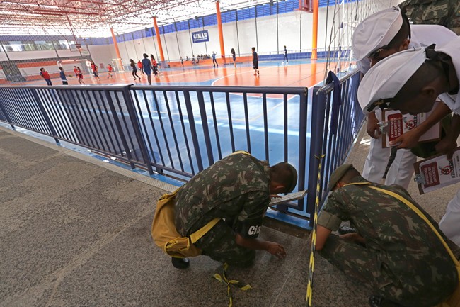 Army soldiers conduct an inspection in a school during a national day of awareness to eradicate the Aedes aegypti mosquito in Brasilia Brazil Friday Feb. 19 2016. The Aedes aegypti mosquito is a vector for the spread of the Zika virus it lives large