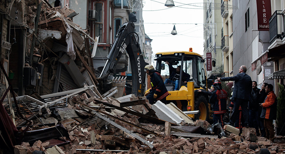 Firefighters attend the scene after two old buildings collapsed in the Beyoglu district in Istanbul Turkey Friday Feb. 12 2016