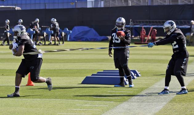 Carolina Panthers running back Cameron Artis-Payne left Mike Tolbert and Brandon Wegher left participate in drills during a practice in preparation for the Super Bowl 50 football game Thursday Feb. 4 2016 in San Jose Calif. (AP