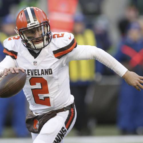 Cleveland Browns quarterback Johnny Manziel looks to pass against the Seattle Seahawks in the second half of an NFL football game in Seattle. Johnny Manziel's ex-girlfriend told police the Clev