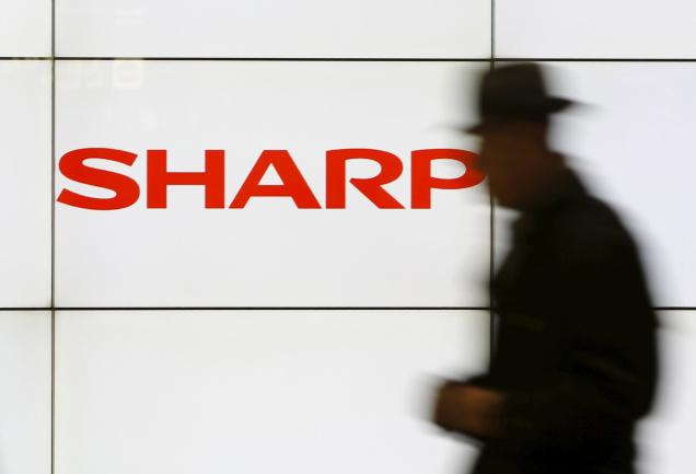 Sharp share prices initially were higher on the Tokyo Stock Exchange but they finished 14 per cent lower