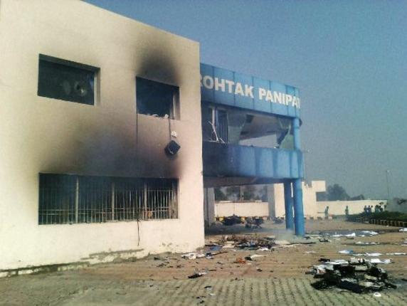 The Dahar toll plaza building damaged in fire as the Jat agitation demanding reservation intensifies in Panipat on Saturday