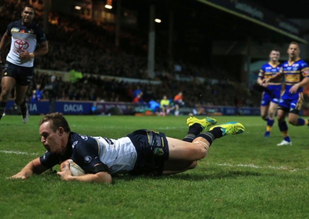 North Queensland Cowboys Michael Morgan dives in to score his side's first try