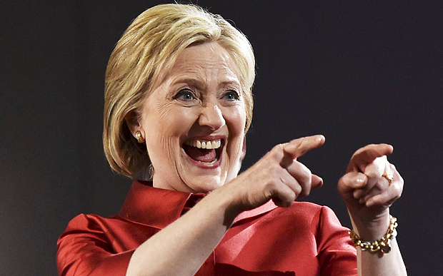 Hillary Clinton gestures to supporters