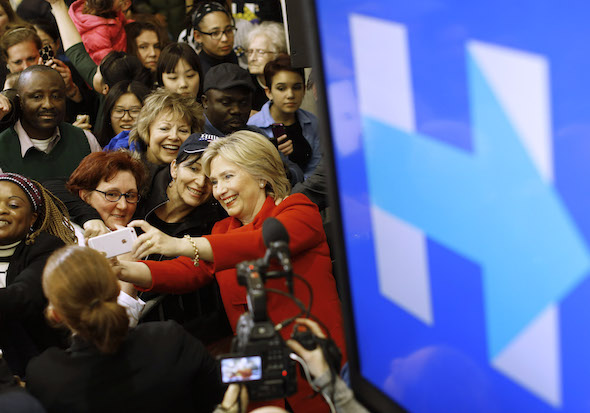 Hillary Clinton takes a selfie with a supporter after speaking at a high school in West Des Moines Iowa in January