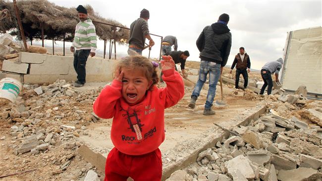 A child cries as Palestinians salvage items from their home after it was demolished by Israeli bulldozers south of al Khalil, Feb. 2 2016