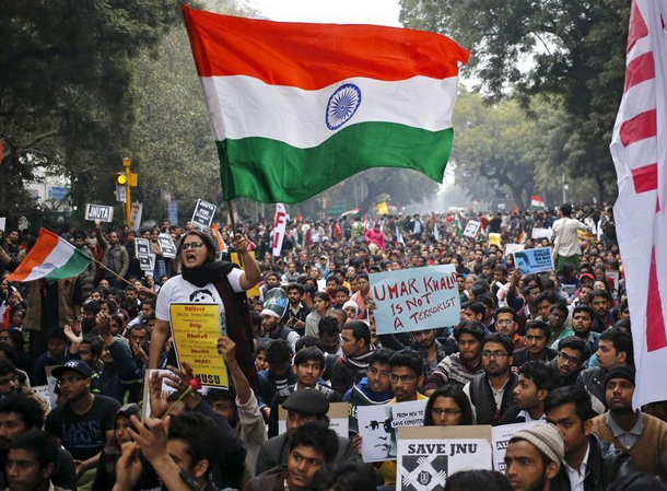 A demonstrator shouts slogans and waves the Indian national flag as she takes part in a protest demanding the release of Kanhaiya Kumar a Jawaharlal Nehru University student union leader accused of sedition in New Delhi India