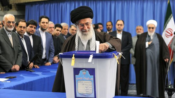 Iran's Supreme Leader Ayatollah Ali Khamenei casts his vote during elections for the parliament and Assembly