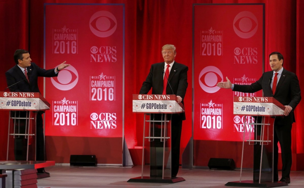 Republican US presidential candidates Senator Ted Cruz and Senator Marco Rubio both gesture at businessman Donald Trump during the Republican US presidential candidates debate sponsored by CBS News and the Republican National Committee in G