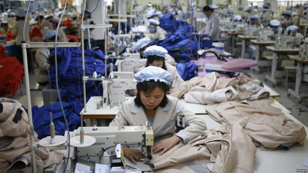 FILE- North Korean employees shown in December 2013 sew in a South Korean-owned company at the Kaesong industrial park just north of the demilitarized zone