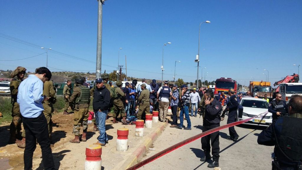 Army and rescue forces at the scene of a stabbing attack at the Etzion Junction in the West Bank on Wednesday