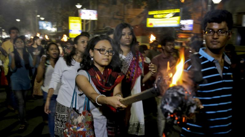 Students of Jadavpur University march in a torch light procession protesting against the arrest of Kanhaiya Kumar