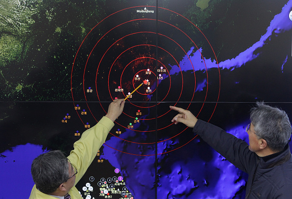 Scientists from the Korea Meteorological Administration point at the screen showing seismic waves near Seoul South Korea caused by a North Korean hydrogen bomb test on Jan. 6 2016