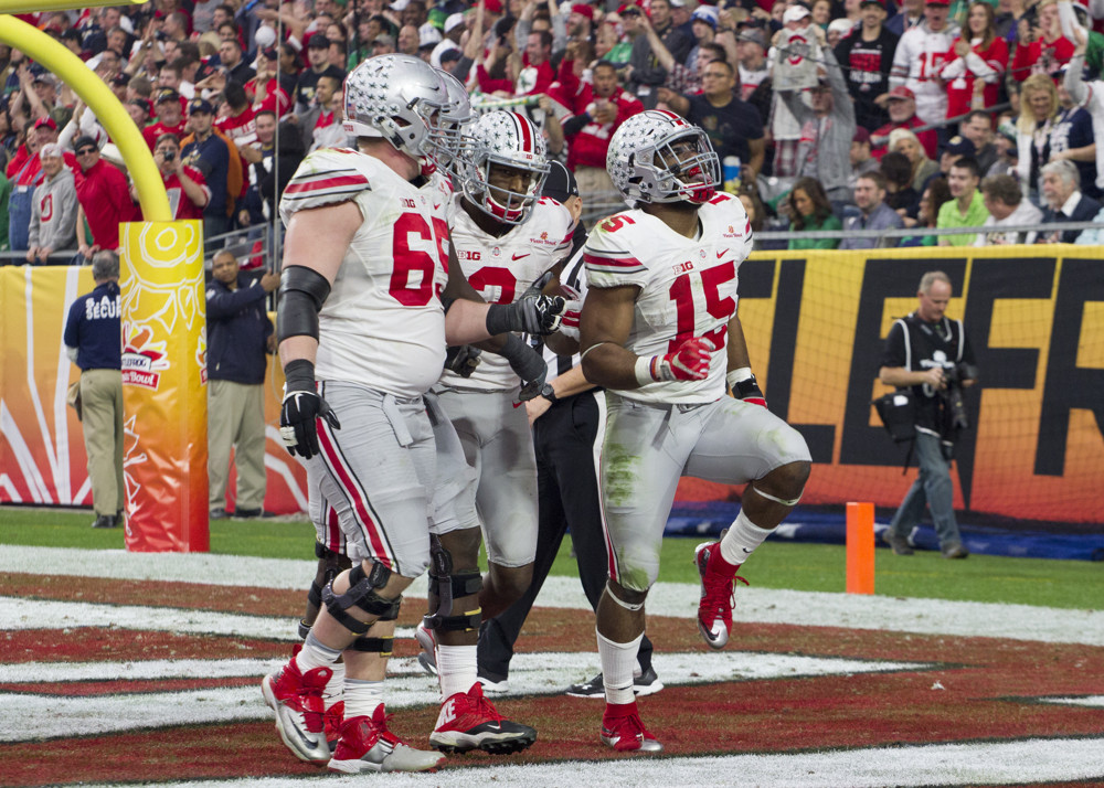 Jan 01 2016 Glendale AZ USA Ohio State Buckeyes running back Ezekiel Elliott celebrates a touchdown during the Battle Frog Fiesta Bowl between the Ohio State Buckeyes and the Notre Dame Fighting Irish at the University of Phoenix Stadium