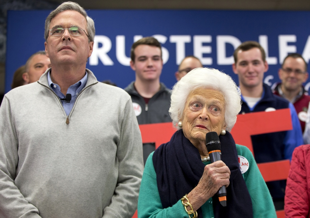 Former Florida Gov. Jeb Bush left and mother Barbara Bush right speak at a town hall meeting at West Running Brook Middle School in Derry N.H. Thursday Feb. 4 2016