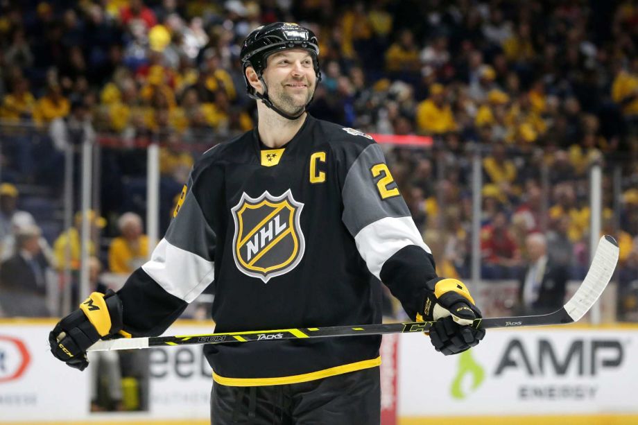 John Scott scored two goals in the first round of the NHL all-star game pacing the Pacific division in a 9-6 victory over the Central all-stars