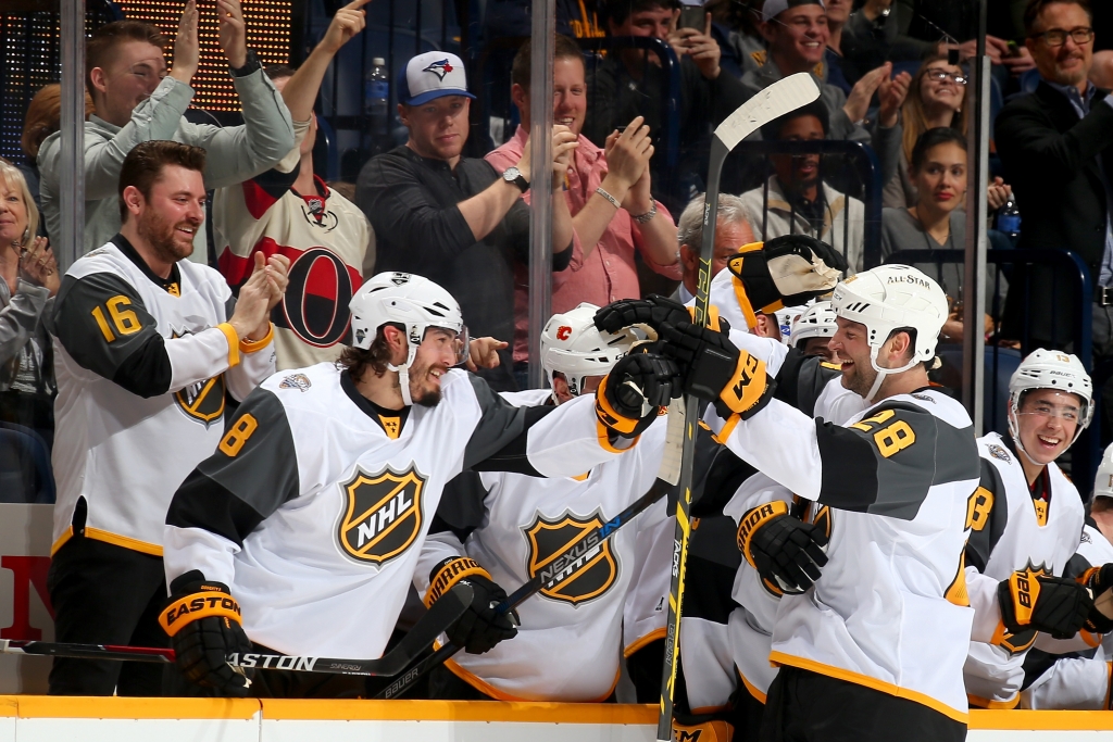 John Scott right celebrates with Pacific Division teammates during the NHL All Star Game 3-on-3 tournament at Bridgestone Arena in Nashville on Jan. 31 2016