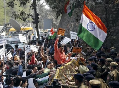 Activists from various Hindu right-wing groups shout slogans as they try to cross a police barricade during a protest against the students of Jawaharlal Nehru University outside the university campus in New Delhi India