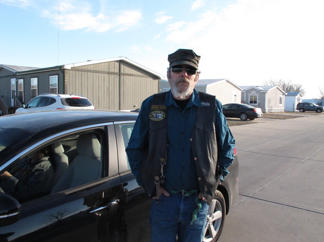 Dennis Britton Sr., of Newton Kan. pauses while discussing the shooting and wounding of his son Dennis Britton Jr. at a nearby plant in Hesston Kan.