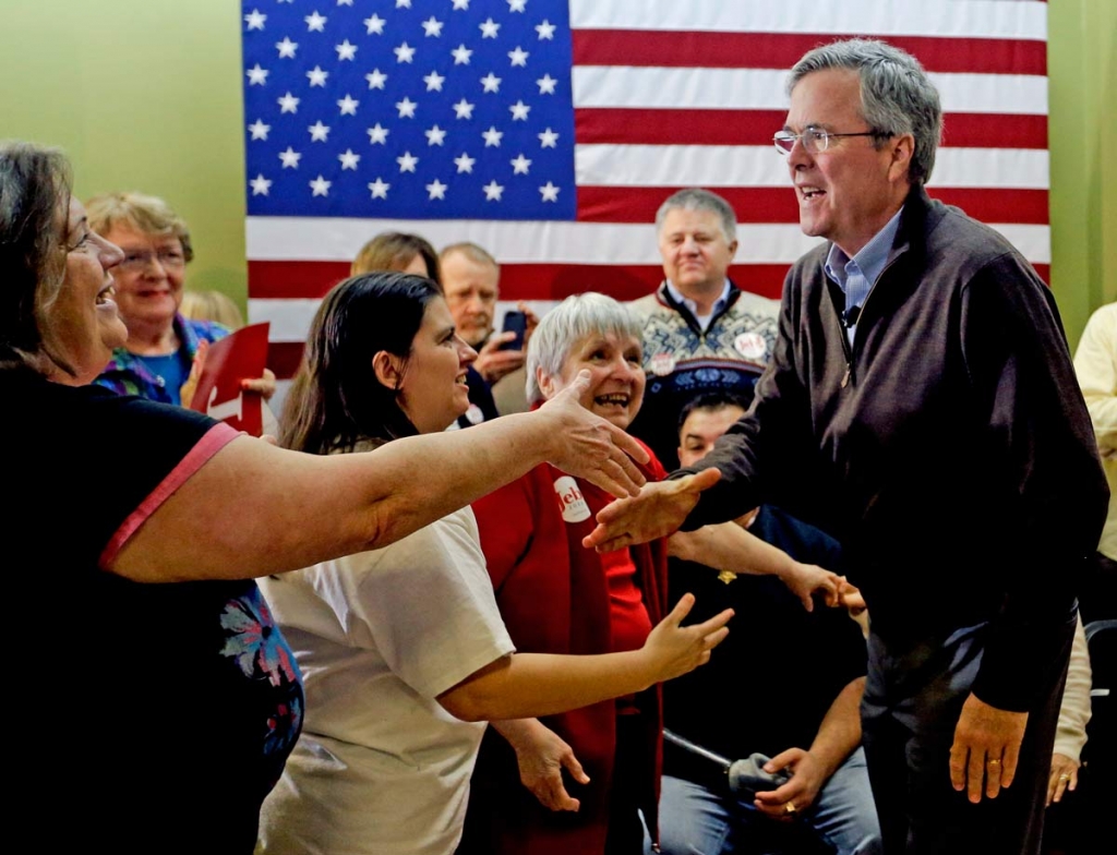 Republican presidential candidate Jeb Bush greets the crowd after a campaign event at the Jeb 2016 field office Sunday Jan. 31 2016 in Hiawatha Iowa