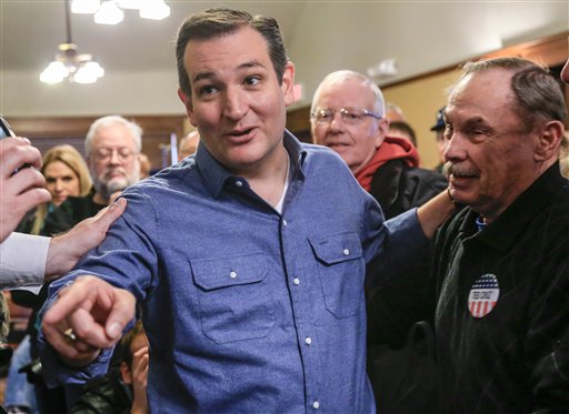 Republican Presidential candidate Sen. Ted Cruz R Texas talks to a reporter while standing with supporter Court Oviatt of Logan Iowa after a campaign speech at the public library in Onawa Iowa Tuesday Jan. 5 2016